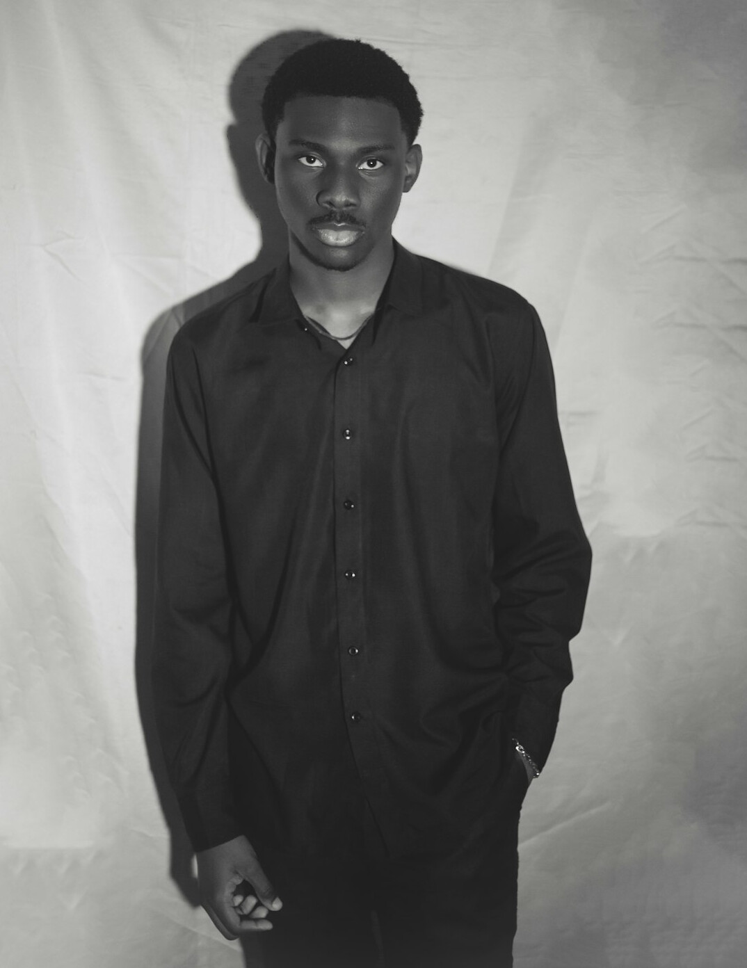 Studio portrait of a man in a collared shirt